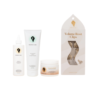 Set of hair care products including bottles and a jar with packaging on a white background