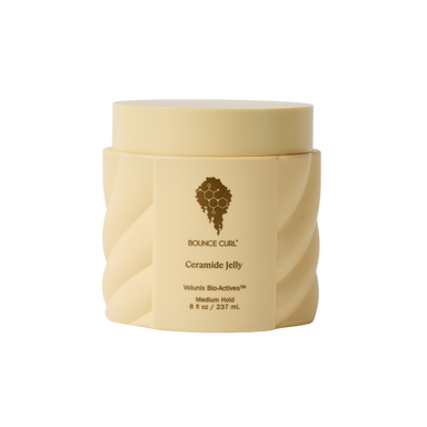 Beige jar of Bounce Curl Ceramide Jelly on a white background