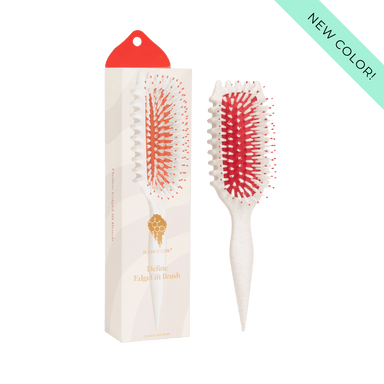 Hairbrush with red bristles and packaging on a green background