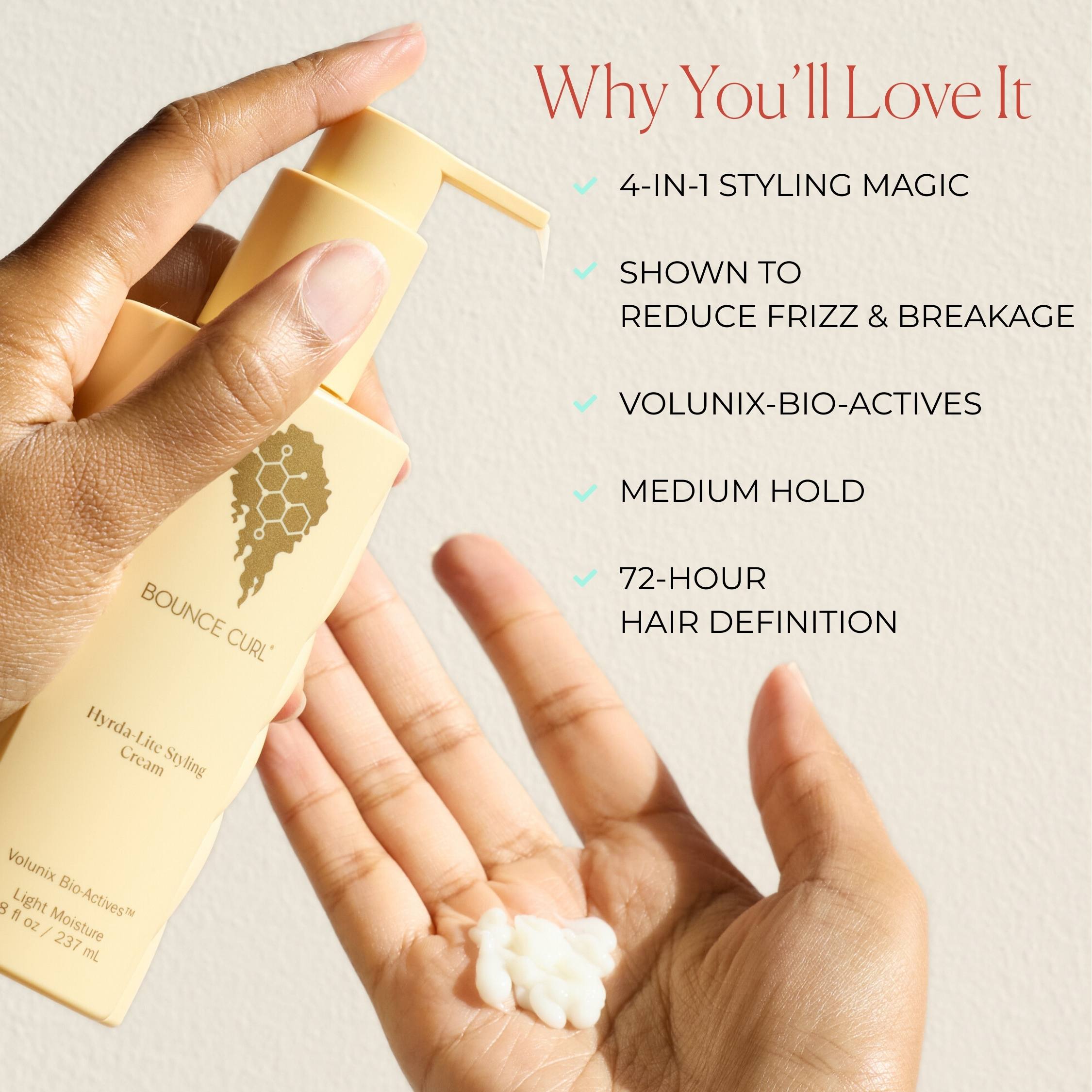 Hand holding a bottle of hair styling cream with product features listed on a beige background