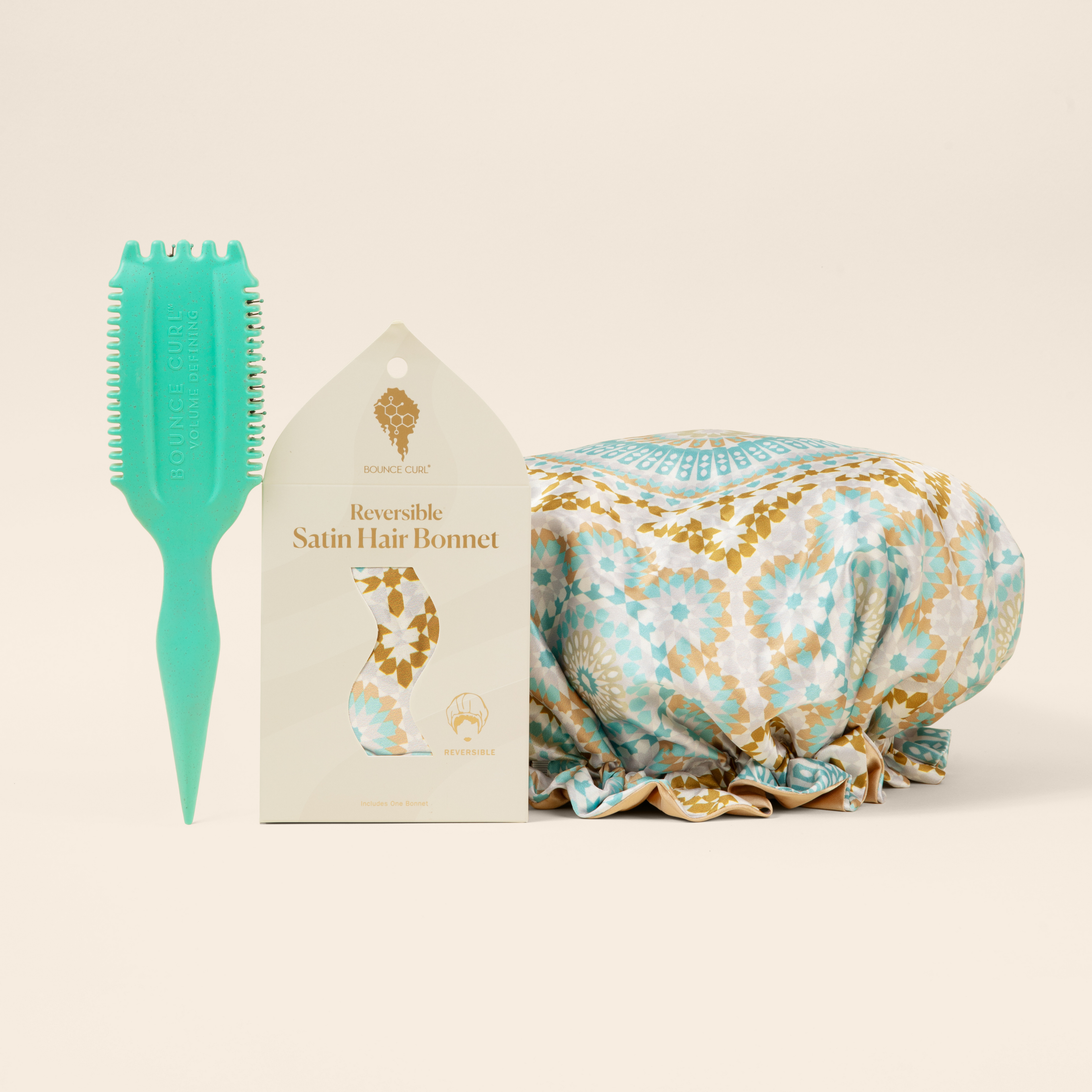 Bounce Curl set: mint pick comb, product box, and patterned hair accessory on white background.
