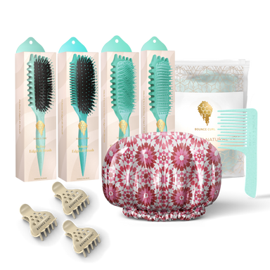 Set of hair care products including brushes, a shower cap, and clips on a white background.