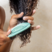 Bounce Curl Detangling Brush lifestyle shot