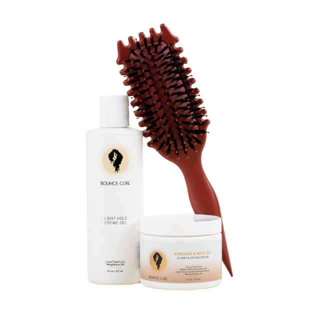 Bounce Curl high definition bundle featuring two Bounce Curl hair products and a styling hairbrush. 